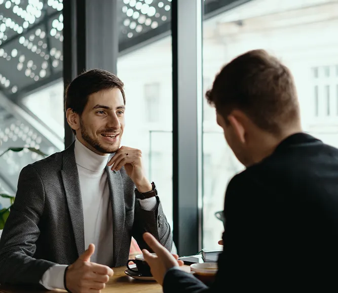 Two Young Businessmen Discussing Eathype